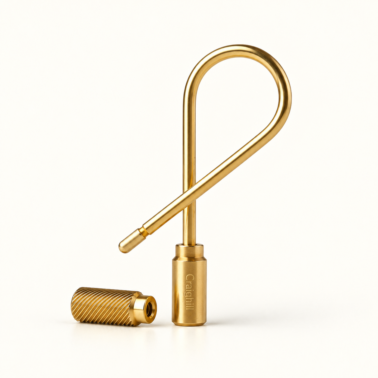 AI-generated illustration of the Craighill Closed Helix Keyring in Brass, with its knurled cap removed beside the crossed wire loop and smooth engraved end cap.